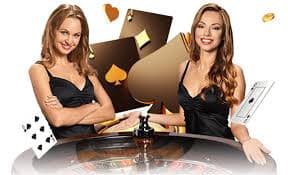 Live dealer studio with multiple payment method icons displayed on screens showing DANA, OVO, GoPay, ShopeePay integration